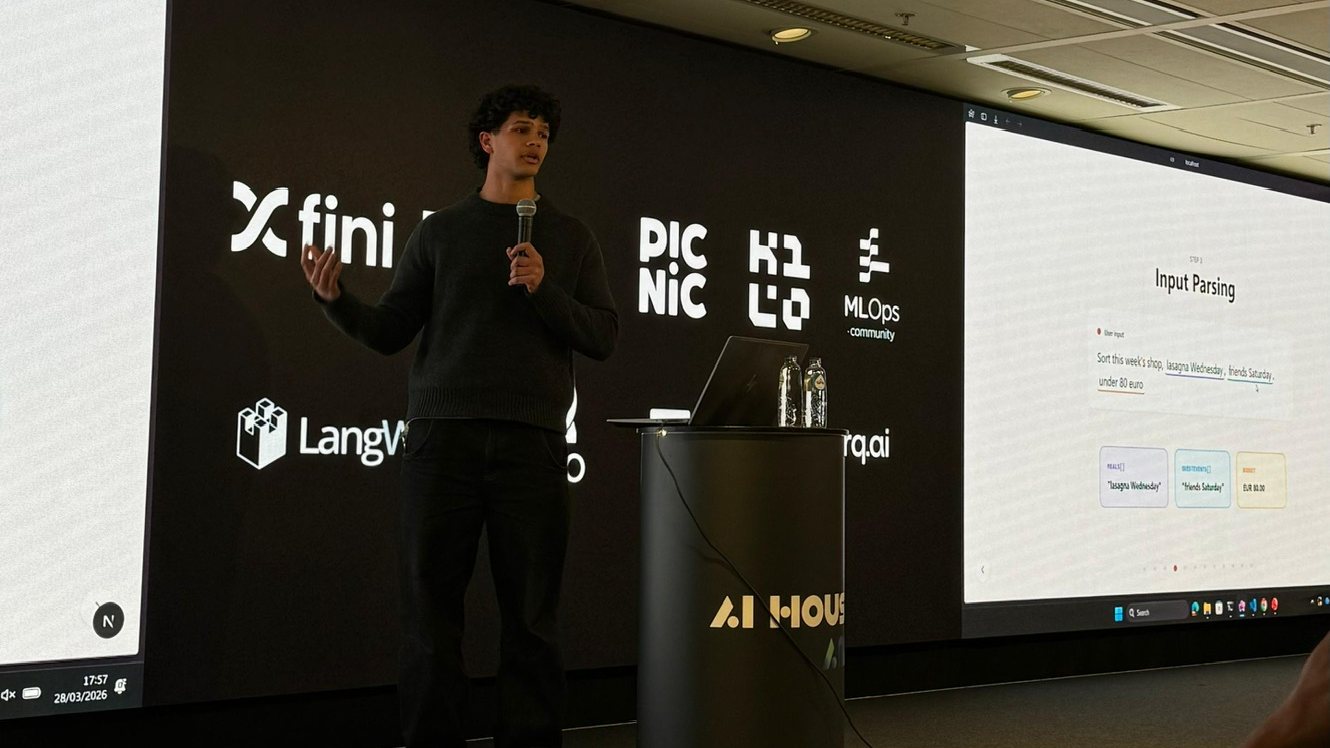 Lucas pitching Weekly Shop Agent on stage at AI House Amsterdam